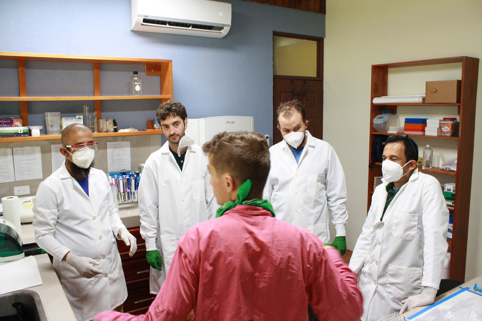 Photo of team members doing lab work